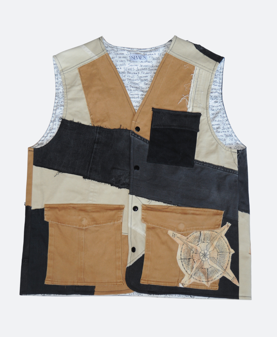 Voorkant - Handgemaakt upcycled denim utility vest in aardetinten: Zwart, Beige en Bruin met kompasdetail en drie zakken, ontwerp van Sevaes.