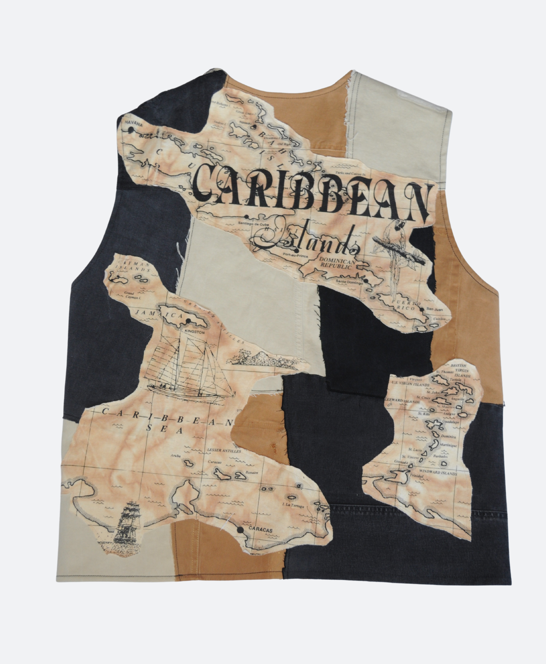 Achterkant - Handgemaakt Caribbean upcycled denim utility vest in aardetinten: Zwart, Beige en Bruin met kompasdetail en drie zakken, ontwerp van Sevaes.